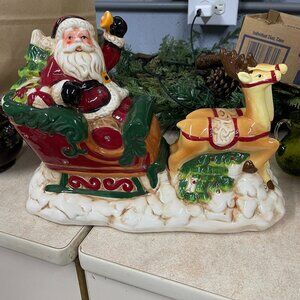 Ceramic Santa and Sleigh lights up and plays music